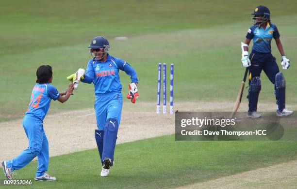 Sushma Verma of India celebrates celebrates with bowler Poonam Yadav of India after stumping Nipuni Hansika of Sri Lanka during the ICC Women's World...