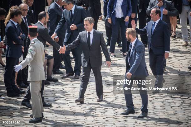 Both Former French Presidents Francois Hollande and Nicolas Sarkozy who shakes hands with French Prime Minister Edouard Philippe attend the Simone...