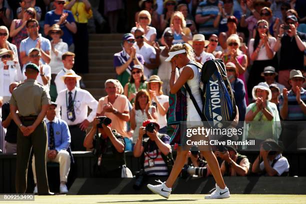 An emotional Donna Vekic of Croatia walks off court after defeat in the Ladies Singles second round match against Johanna Konta of Great Britain on...