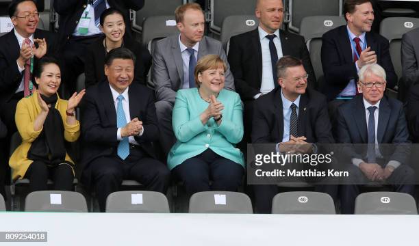 Peng Liyuan, Chinese President Xi Jinping, German Chancellor Angela Merkel , President of the German Football Association Reinhard Grindel and...