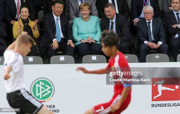 Peng Liyuan, Chinese President Xi Jinping, German Chancellor Angela Merkel , President of the German Football Association Reinhard Grindel and...