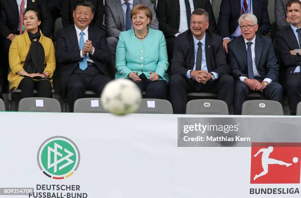 Peng Liyuan, Chinese President Xi Jinping, German Chancellor Angela Merkel , President of the German Football Association Reinhard Grindel and...