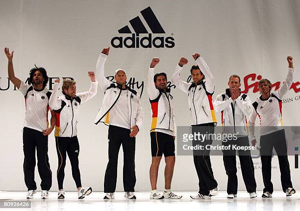 Helge Meeuw , Lars Boergeling , Danny Ecker and Christoph Burkard present the fashion during the kit launch for the German Olympic Team at the...