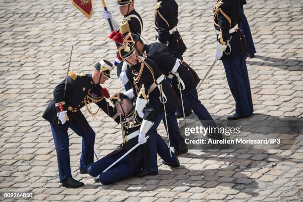 Guard fainted under the heat during the Simone Veil Funeral and national tribute at Hotel des Invalides on July 5, 2017 in Paris, France. Survivor of...