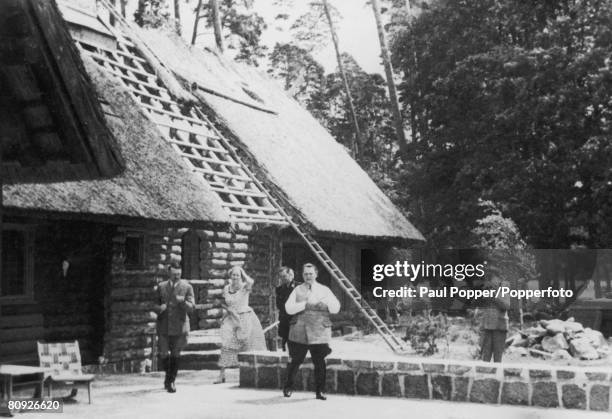 Nazi leader Adolf Hitler with friends at Goering's chalet on the Obersalzberg, 100 metres above the Berghof, circa 1935. From left to right, Hitler,...