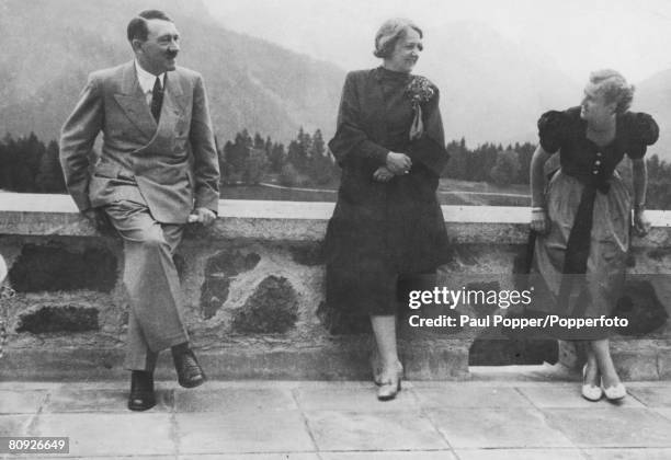From left to right, Nazi leader Adolf Hitler with Johanna Morell, the wife of his personal physician, and Eva Braun , at the Berghof, circa 1937.