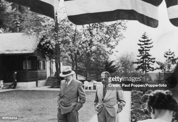 Nazi leader Adolf Hitler with Heinrich Hoffmann , his personal photographer, circa 1935.