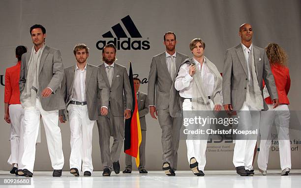 Helge Meeuw , Julius Brink , Christoph Dieckmann and Peter Joppich present the fashion during the kit launch for the German Olympic Team at the...