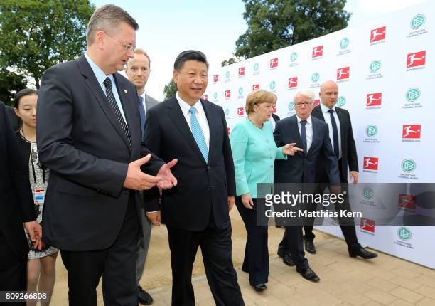 President of the German Football Association Reinhard Grindel, Chinese President Xi Jinping, German Chancellor Angela Merkel and the President of the...