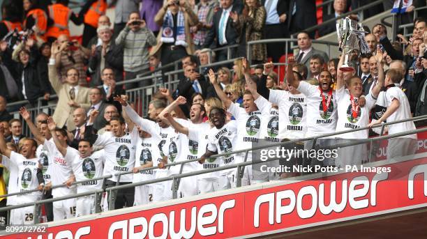 Swansea City celebrate with the Championship Play Off trophy after winning promotion to the Premier League