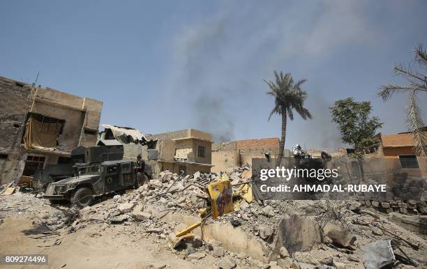 Iraqi Counter-Terrorism Service humvees advance in the Old City of Mosul on July 5, 2017 during the Iraqi government forces' offensive to retake the...