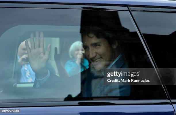 Canadian Prime Minister Justin Trudeau waves to crowds from his Range Rover outside Holyroodhouse after an audience with The Queen at Holyroodhouse...