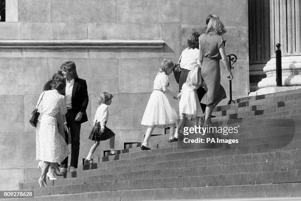 Royal wedding dress designer David Emanuel Walks up the steps of St Paul's Cathedral behind the bridesmaids [from Centre-left, Catherine Cameron,...