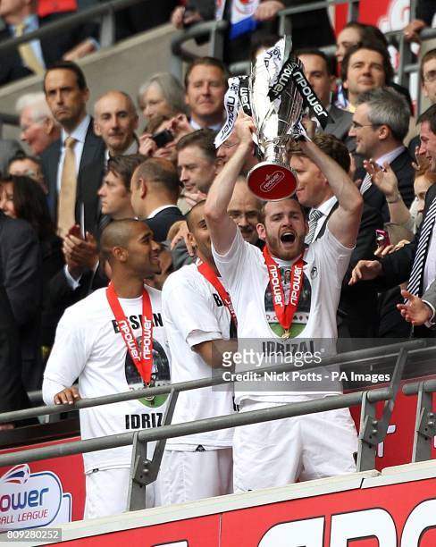 Swansea City's Craig Beattie holds the Championship Play Off trophy aloft