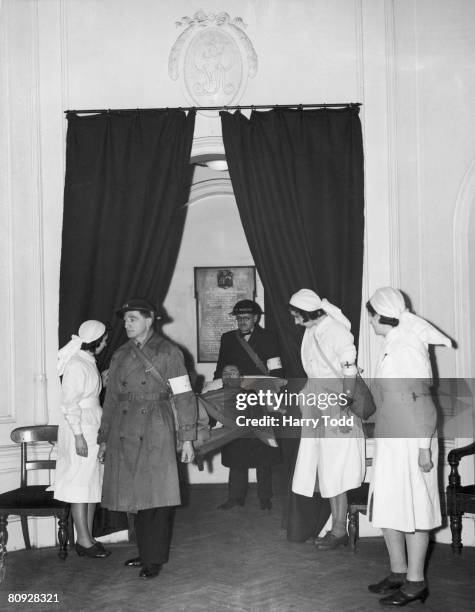 The royal waiting room at Paddington Station, London, being used as a casualty clearing station, 24th January 1940.