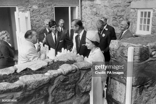 Minister of Labour, Ray Gunter and his wife, Elsie talk with Queen Elizabeth II, Philip, Duke of Edinburgh, and Prince Charles during the Royal...