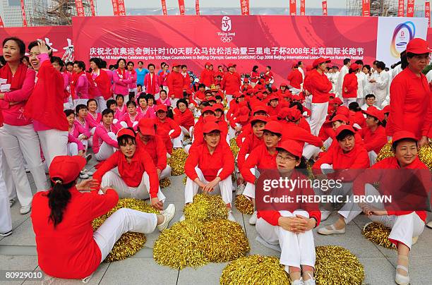 Colour coordinated uniformity seperates various groups waiting to perform or participate during celebrations at the Olympic central area, between the...