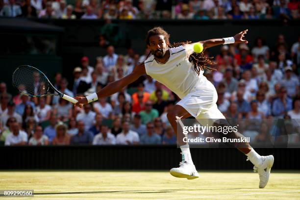 Dustin Brown of Germany plays a forehand during the Gentlemen's Singles second round match against Andy Murray of Great Britain on day three of the...