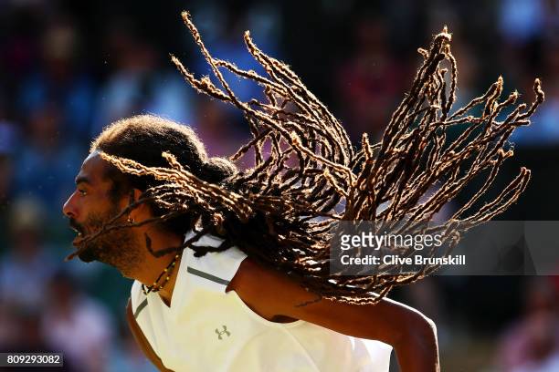 Dustin Brown of Germany in action during the Gentlemen's Singles second round match against Andy Murray of Great Britain on day three of the...