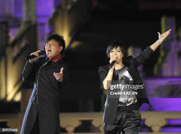 Taiwanese singer A-mei Chang and Chinese mainland singer Sun Nan perform during the Fourth Music Award of Beijing Olympic Games, as part of the...