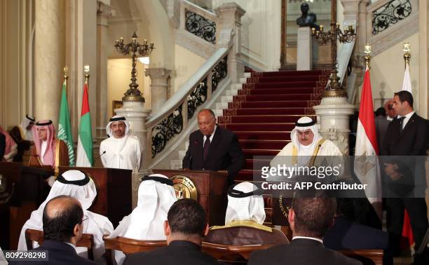 Egyptian Foreign Minister Sameh Shoukry reads a statement while giving a joint press conference with Saudi Foreign Minister Adel al-Jubeir , UAE...