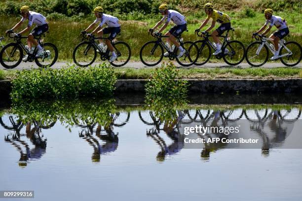 Great Britain's Luke Rowe, Poland's Michal Kwiatkowski, Great Britain's Christopher Froome, Great Britain's Geraint Thomas wearing the overall...