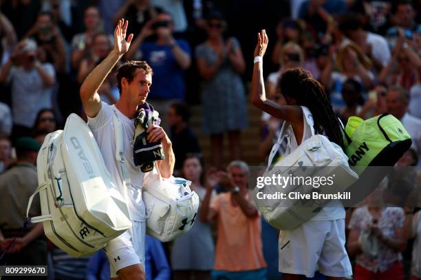 Both Andy Murray of Great and Dustin Brown of Germany acknowledge the crowd after their Gentlemen's Singles second round match on day three of the...