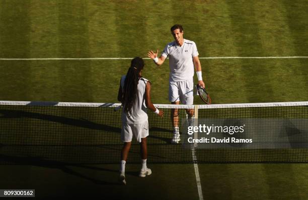 Andy Murray of Great and Dustin Brown of Germany shake hands after their Gentlemen's Singles second round match on day three of the Wimbledon Lawn...