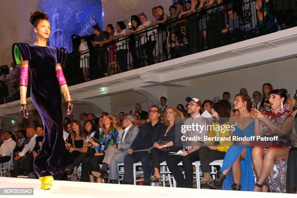 Model Noemie Lenoir walks the runway in front of Vincent Dedienne, Carla Bruni-Sarkozy, Emmanuelle Alt, Owners of Gaultier Manuel Puig and his...