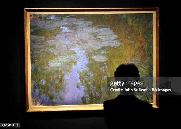 An Art lover admires the painting by Claude Monet titled Nympheas, which is valued at 17million and is one of several masterpieces that will launch a...