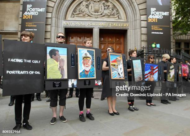 Climate activists protest outside the official opening of the BP Portrait Award 2011, at the National Portrait Gallery, in central London.