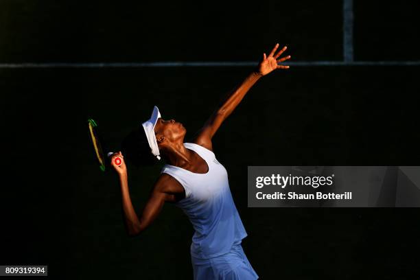 Venus Williams of The United States serves during the Ladies Singles second round match against Qiang Wang of China on day three of the Wimbledon...