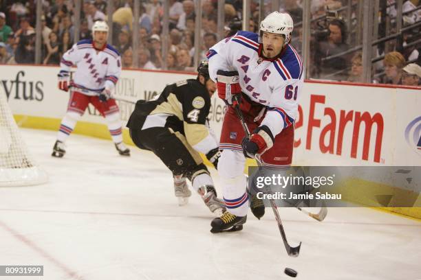 Jaromir Jagr of the New York Rangers skates with the puck against the Pittsburgh Penguins during game two of the Eastern Conference Semifinals of the...