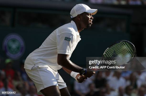 Player Donald Young waits to receive a serve from Spain's Rafael Nadal during their men's singles second round match on the third day of the 2017...