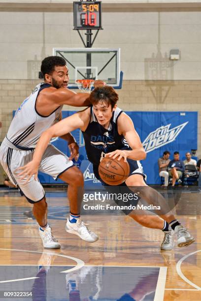 Ding Yanyuhang of the Dallas Mavericks drives to the basket against the Oklahoma City Thunder during the Mountain Dew Orlando Pro Summer League on...