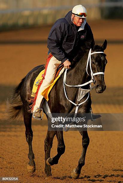 Trainer Larry Jones rides Eight Belles during the morning training session in preparation for the 134th Kentucky Derby at Churchill Downs April 30,...
