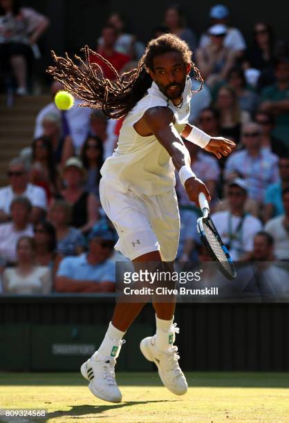 Dustin Brown of Germany plays a backhand during the Gentlemen's Singles second round match against Andy Murray of Great Britain on day three of the...