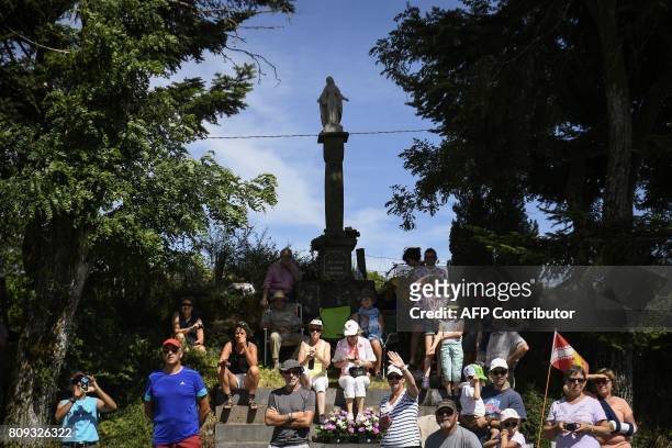 Supporters cheer along the road during the 160,5 km fifth stage of the 104th edition of the Tour de France cycling race on July 5, 2017 between...