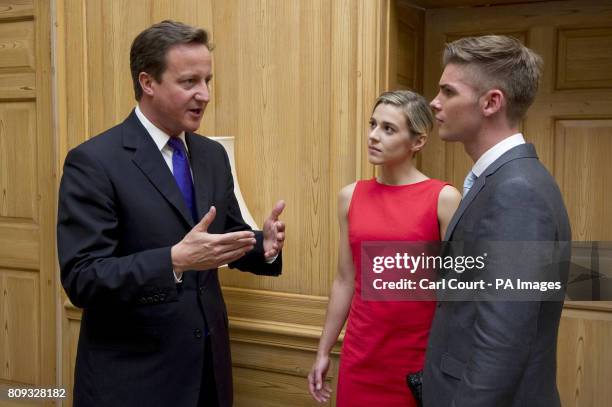 Prime Minister David Cameron talks with Hollyoaks actors Victoria Atkin and Kieron Richardson, during a reception in 10 Downing Street, central...