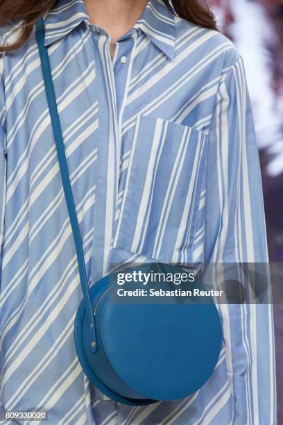 Model walks the runway, bag detail, at the Holy Ghost show during the Mercedes-Benz Fashion Week Berlin Spring/Summer 2018 at Heeresbaeckerei on July...