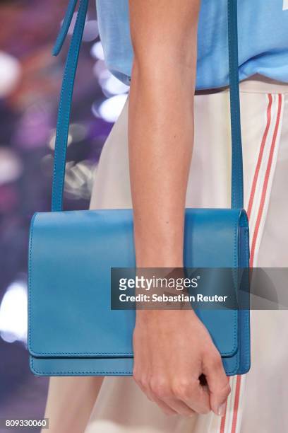 Model walks the runway, bag detail, at the Holy Ghost show during the Mercedes-Benz Fashion Week Berlin Spring/Summer 2018 at Heeresbaeckerei on July...