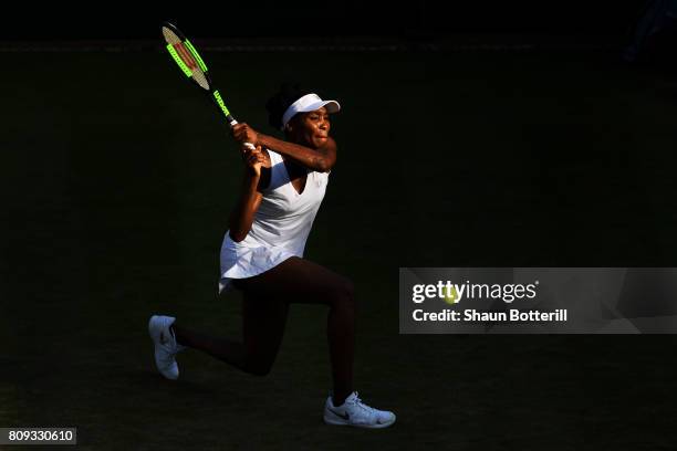 Venus Williams of The United States plays a backhand during the Ladies Singles second round match against Qiang Wang of China on day three of the...