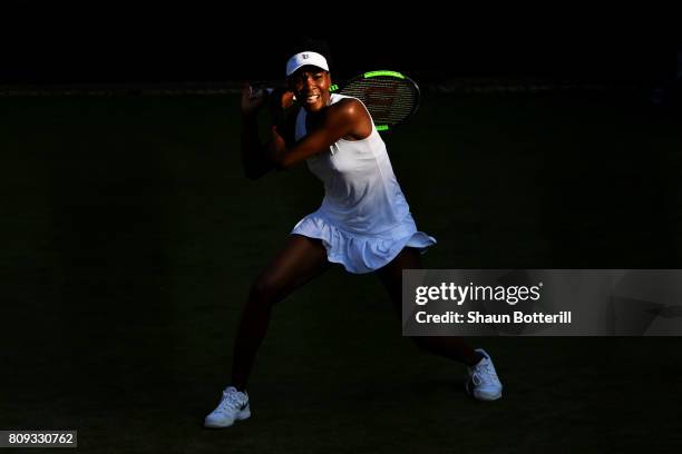 Venus Williams of The United States plays a backhand during the Ladies Singles second round match against Qiang Wang of China on day three of the...