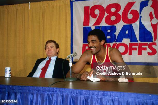 Ralph Sampson of the Houston Rockets talks with the media along with Bill Fitch of the Houston Rockets during the 1986 NBA Playoffs during a game...