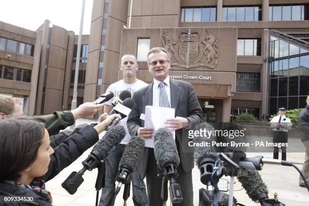 Solicitor Robin Makin read a statement to the media as Ralph Bulger, the father of James Bulger, looks on outside Liverpool Crown Court as they made...