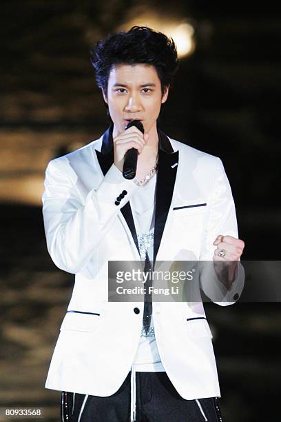 Taiwanese pop singer Lee-Hom Wang performs during the Award-giving Ceremony for the 4th Olympic Songs Competition at the illuminated Worker People's...