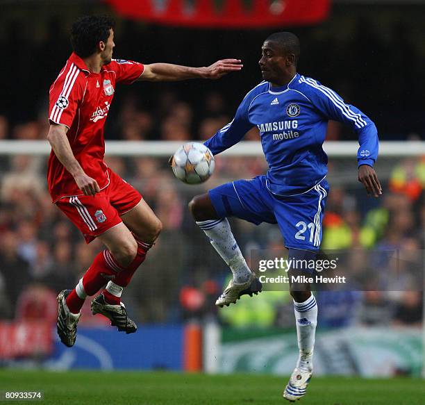 Alvaro Arbeloa of Liverpool takes jumps with Salomon Kalou of Chelsea during the UEFA Champions League Semi Final 2nd leg match between Chelsea and...