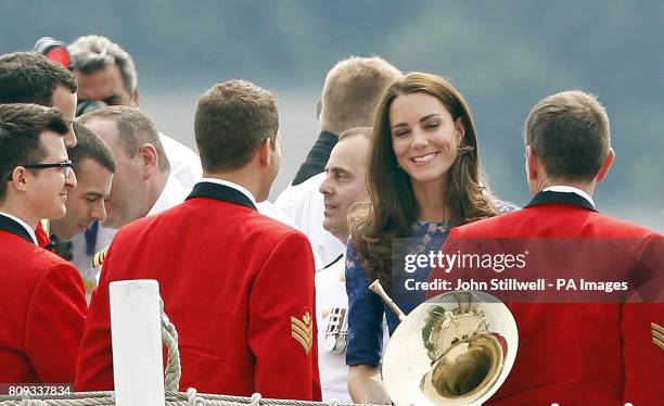 The Duchess of Cambridge meets some band members on board HMCS Montreal, following a morning prayer service on the helicopter pad at the rear of the...