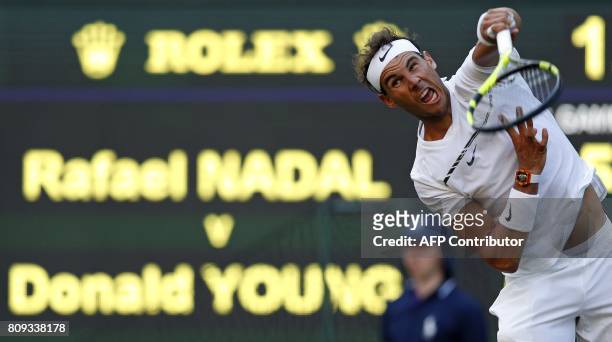 Spain's Rafael Nadal serves against US player Donald Young during their men's singles second round match on the third day of the 2017 Wimbledon...