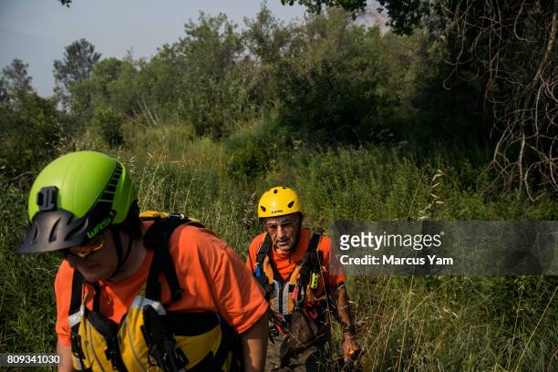 Ransom Yarger and Paulina Stanfield, conducts a search mission for the missing person reported the day before, in a raging part of the Kern River, in...